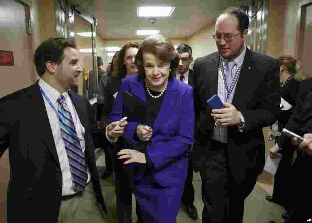 Senate Intelligence Committee Chair Sen. Dianne Feinstein, D-Calif. is pursued by reporters as she arrives to release a report on the CIA&#39;s harsh interrogation techniques at secret overseas facilities, Washington,&nbsp; Dec. 9, 2014.