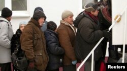 Belarusians queue for X-rays to detect tuberculosis during Belarusian Red Cross screening, Minsk, Jan. 29, 2013.