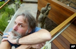 FILE - Bob Weir of the Grateful Dead poses for a photo outside his home in Mill Valley, California, April 15, 2004.