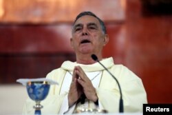 FILE - Salvador Rangel, bishop of Chilpancingo-Chilapa, arrives to a mass in Chilpancingo, Guerrero state, Mexico, June 7, 2018.