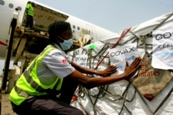 FILE - A shipment of COVID-19 vaccines distributed by the COVAX global initiative arrives in Abidjan, Ivory Coast, Feb. 25, 2021.