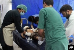 An injured boy receives treatment at a hospital after a clash between Taliban and security forces in Kunduz province, Afghanistan, April 13, 2019.