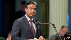 FILE - California Assemblyman Rob Bonta, D-Alameda, speaks during a legislative session, in Sacramento, Aug. 31, 2016. A bill sponsored by Bonta that would have prevented California state employees from being fired for being a member of the Communist Party has been withdrawn.