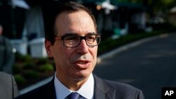 FILE - Treasury Secretary Steve Mnuchin talks with reporters about trade with China outside of the White House, May 21, 2018, in Washington. 