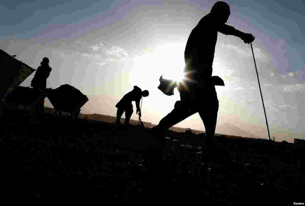 Laborers work at a brick factory outside Kabul, Afghanistan.