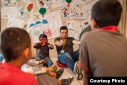 The International Rescue Committee organizes psycho-social activities for children who have been settled in overcrowded urban areas, without access to safe and secure places to play and express themselves. (Photo: courtesy Andrea Falcon/IRC)