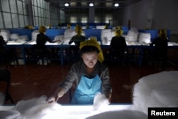 FILE - Women work at the Kim Jong Suk Pyongyang textile mill during a government-organized visit for foreign reporters in Pyongyang, North Korea, May 9, 2016.