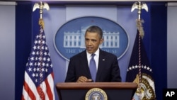 President Barack Obama speaks to reporters in the Brady Press Briefing Room at the White House in Washington after meeting with Congressional leaders regarding the fiscal cliff, December 28, 2012. 