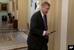 Sen. Lindsey Graham, R-S.C., a member of the Senate Armed Services Committee, rushes to the office of Senate Majority Leader Mitch McConnell, R-Ky., at day's end on Capitol Hill in Washington, Dec. 19, 2018. Amid the news that President Donald Trump is pulling all 2,000 U.S. troops out of Syria, Graham said he was "blindsided" by the report and called the decision "a disaster in the making."