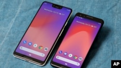 The Google Pixel 3 XL, left, and Google Pixel 3 smartphones are shown in this photo, in New York, Wednesday, Oct. 10, 2018. (AP Photo/Richard Drew)