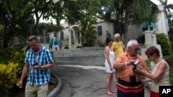 Tourists walk around the home that once belonged to author Ernest Hemingway, known as Finca Vigia, in Havana, Cuba, June 22, 2015.
