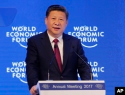 FILE - China's President Xi Jinping speaks at the World Economic Forum in Davos, Switzerland, Jan. 17, 2017.