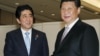 China's Xi, Japan's Abe Hold Rare Meeting 