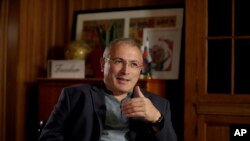 FILE - Russian opposition figure Mikhail Khodorkovsky, the former owner of the Yukos Oil Company, speaks during an interview by The Associated Press in London, Tuesday, July 24, 2018. 