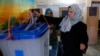 Iraqis Vote Amidst Violence