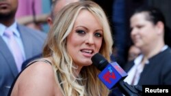 FILE - Stormy Daniels, the porn star currently in legal battles with U.S. President Donald Trump, speaks in West Hollywood, California, May 23, 2018. 