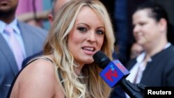 FILE - Stormy Daniels, the porn star currently in legal battles with U.S. President Donald Trump, speaks in West Hollywood, Calif., May 23, 2018. 