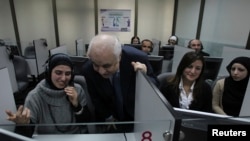 Dr. Talal Abu-Ghazaleh with students during a course held at Talal Abu-Ghazaleh Graduate School of Business, Amman, March 19, 2012.