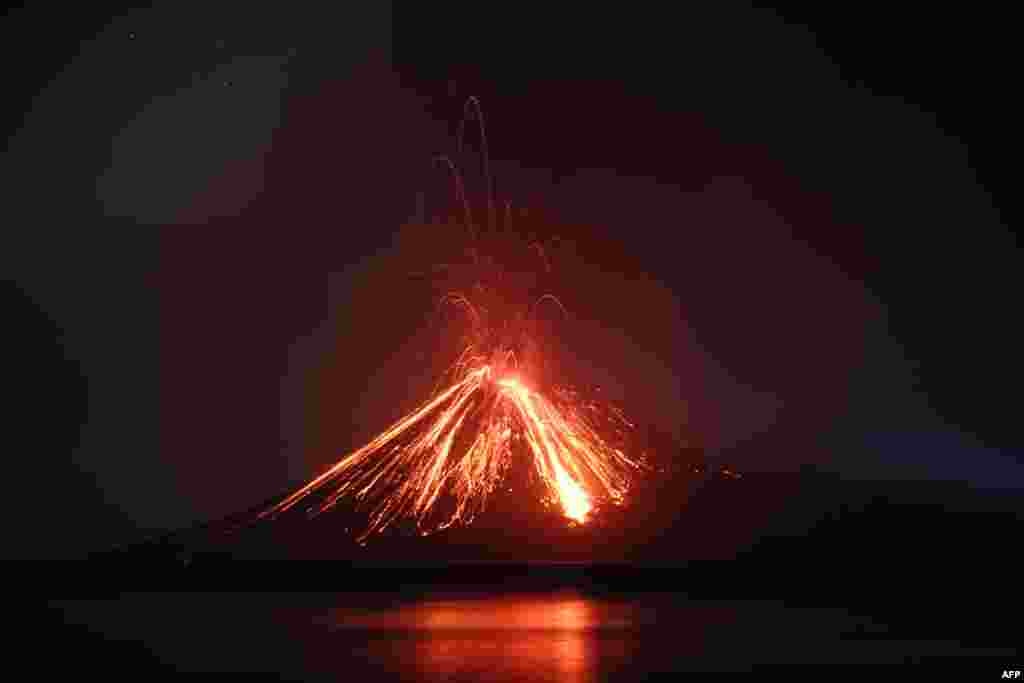 Lava streams down from the Anak Krakatau (Child of Krakatoa) volcano during an eruption, as seen from Rakata island in South Lampung, Indonesia.