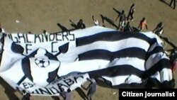 Highlanders Football Club supporters at Barbourfields Stadium.