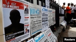 A Congolese news paper with the headline "The next president is him" is seen at a news stand in Kinshasa, Democratic Republic of Congo, Jan. 9, 2019. 