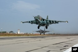 Russian Su-25 jets takes off for a mission from Hemeimeem airbase in Syria, October 22, 2015.