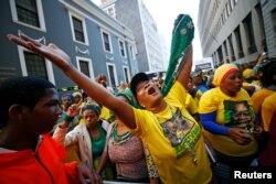 Pro-Zuma supporters cheer during the vote of no confidence against President Jacob Zuma in Cape Town, South Africa, Aug. 8, 2017.