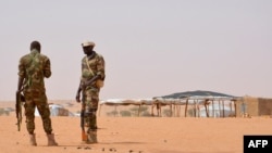 FILE - Niger soldiers stand guard in the Tahoua region, October 21, 2016.