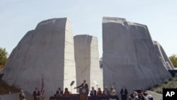 President Barack Obama speaks at the dedication of the Martin Luther King Jr. Memorial in Washington, October 16, 2011.