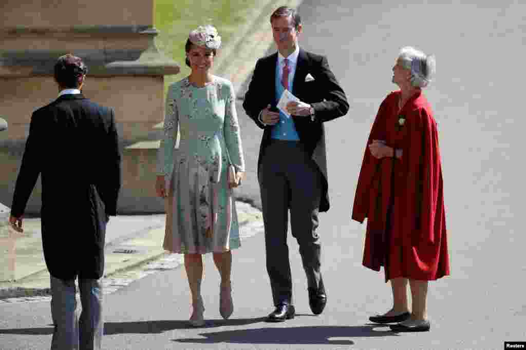 Pippa Middleton, left, and her husband James Matthews, right, arrive for the wedding ceremony of Britain's Prince Harry, Duke of Sussex and U.S. actress Meghan Markle at St George's Chapel, Windsor Castle, in Windsor, May 19, 2018.
