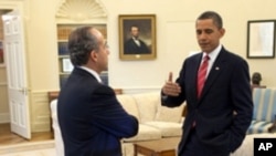 President Barack Obama and President Felipe Calderón of Mexico confer in the Oval Office, before their joint press conference in the Rose Garden of the White House, May 19, 2010