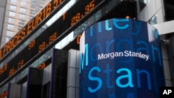 FILE - A Morgan Stanley billboard is displayed in Times Square, New York, Jan. 18, 2011. Morgan Stanley plans to offer savings accounts and certificates of deposits next year to wring more profit from its wealth management clients, executives told Reuters