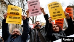 FILE - Journalists demanding greater media freedom are seen at a rally against Turkey's ruling AK Party.