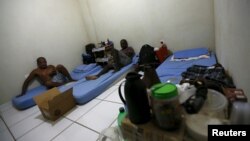 Laid-off workers of Comperj are pictured at a room of the Pousada do Trabalhador (Workers Inn), which closed down after the scandal involving Petrobras, on its last day of operations, in Itaborai March 31, 2015. 