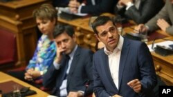 Greek Prime Minister Alexis Tsipras speaks during a parliamentary session in Athens, June 14, 2018.