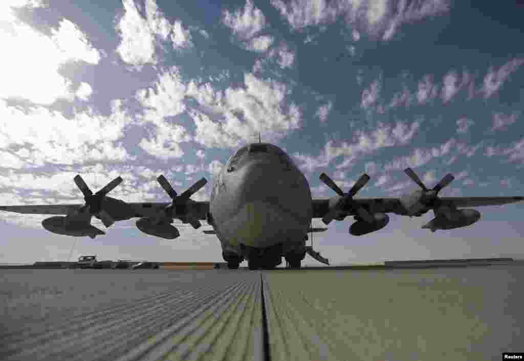 A U.S. military airplane carrying military gear waits to take off at Camp Bastion in Helmand province, Oct. 25, 2014. 