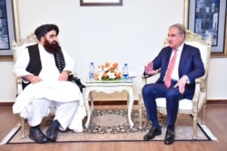 Foreign Minister Amir Khan Muttaqi of Afghanistan's Taliban held talks with Pakistan Foreign Minister Shah Mehmood Qureshi on the eve of OIC summit. (courtesy Pakistan foreign ministry)