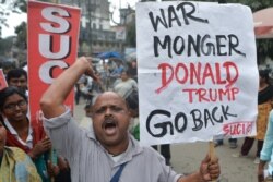 Activists of Socialist Unity Centre of India (Communist) shout slogans as they protest against US President Donald Trump's visit to India, in Siliguri February 24, 2020.