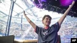 In this Sunday, July 28, 2019 photo provided by Epic games, Kyle Giersdorf reacts after he won the Fortnite World Cup solo finals in New York. Giersdorf, of Pottsgrove, Pa. who goes by the name "Bugha" when competing, racked up the most points and won $3 