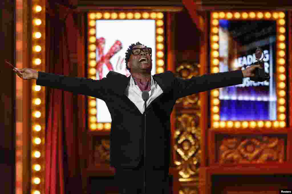 Actor Billy Porter accepts the award for Best Performance by an Actor in a Leading Role in a Musical for "Kinky Boots" during the Tony Awards in New York, June 9, 2013.