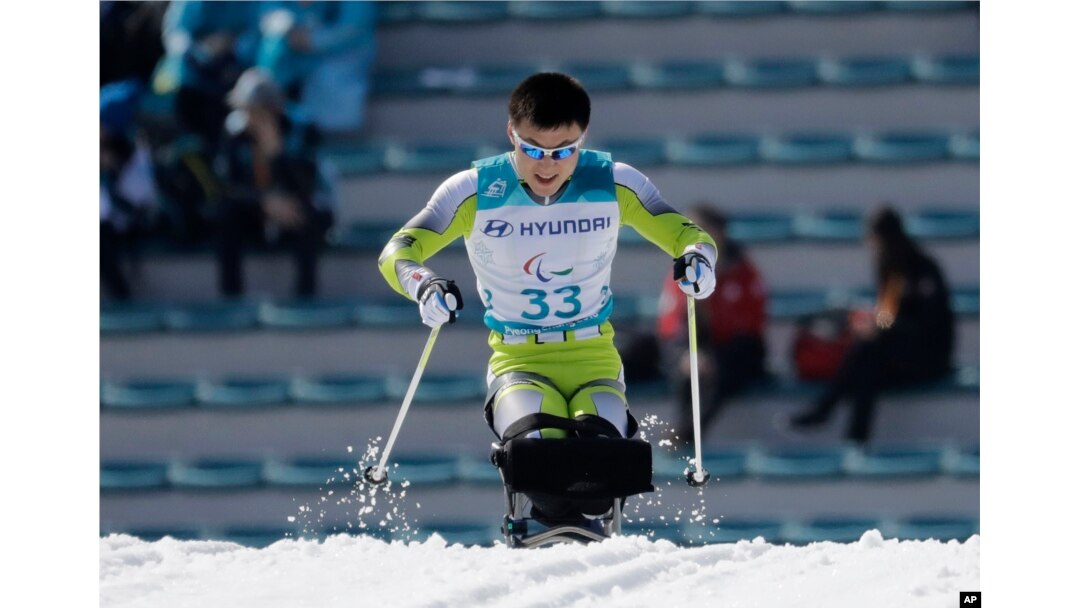 Kim Jong Hyon of North Korea competes in the qualification round, March 14, 2018, of the men's 1.1 km sprint, sitting, cross-country skiing at the 2018 Winter Paralympics in Pyeongchang, South Korea.