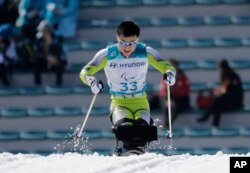 Kim Jong Hyon of North Korea competes in the qualification round, March 14, 2018, of the men's 1.1 km sprint, sitting, cross-country skiing at the 2018 Winter Paralympics in Pyeongchang, South Korea.