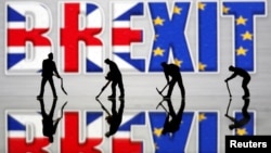 Small toy figures are seen in front of a Brexit logo in this illustration picture, March 30, 2019. 