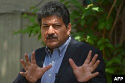 حامد میر پاکستان میں صحافیوں پر نامعلوم افراد کی جانب سے تشدد کے خلاف احتجاج کر رہے ہیں۔ 26 مئی 2021
