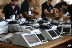 Employees of the Regional Electoral Tribunal work on preparing voting machines in Brasilia, Brazil, Oct. 3, 2018. Brazilian will hold general elections on Oct. 7.