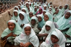In this photo taken April. 6, 2016 Muslim girls wearing hijab attend lectures in a school in Kano, Nigeria. Nigerian girls have the right to wear the hijab headscarf to school, an appeals court has ruled in a country where suicide bombers have abused Islamic dress to hide their deadly weapons.