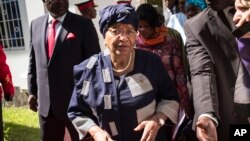 FILE - Sierra Leone President, Ernest Bai Koroma, left, and Liberia President, Ellen Johnson Sirleaf, right, on arrival for talks with President Yahya Jammeh, in Banjul, Gambia.