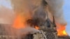 Api dan asap membubung dari atas Katedral Notre Dame di Paris, 15 April 2019.