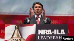 FILE - Then-Texas Governor Rick Perry speaks at the NRA-ILA Leadership Forum at the George R. Brown Convention Center, the site for the National Rifle Association's annual meeting in Houston, Texas, May 3, 2013. 