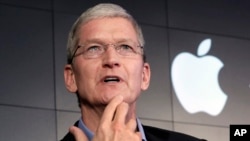 FILE – Apple CEO Tim Cook 